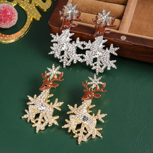 Elegant Christmas reindeer and snowflake brooch set with rhinestones on festive background