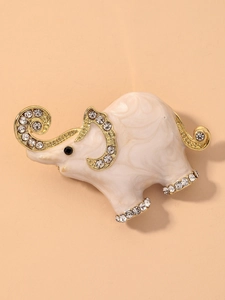 Detail of elephant brooch with light pink enamel, gold plating and sparkling crystals