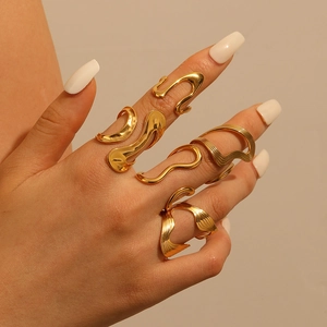 Irregular liquid gold 18k plated stainless steel rings shown on model's fingers