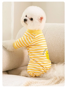 Close-up of yellow and white striped pet pajamas with Happy smiley face print