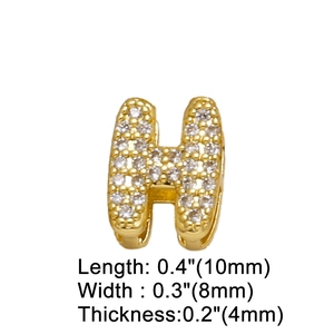 Close-up of gold letter H pendant with crystals showing dimensions 10x8x4 mm