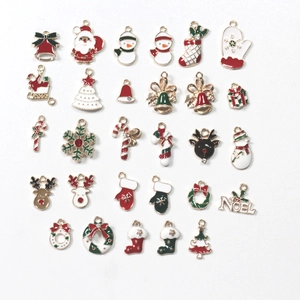 Variety of Christmas themed alloy charms featuring Santa, reindeer and snowflakes