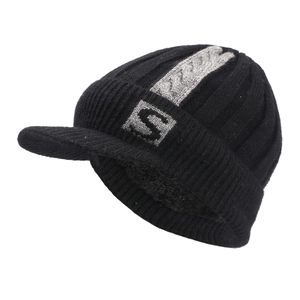Detailed view of the thick plush lining and knit texture of a warm winter peaked beanie