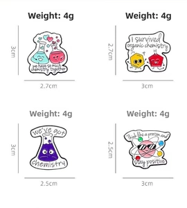 Detail view of 4g science enamel pins with dimensions for flasks and atom models