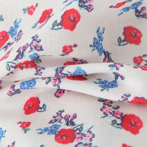 White halter dress with sweet floral embroidery detail and soft flowing A-line fabric
