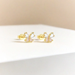 Detailed macro view of S925 sterling silver butterfly stud earrings with colorful stones