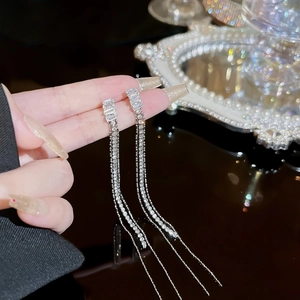Elegant silver long tassel drop earrings featuring sparkling white zircon stones