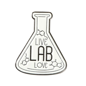 Close-up of conical flask pin badge with Live Lab Love text and chemical structures