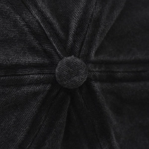 Close-up of black corduroy baseball cap crown showing stitching detail and top button