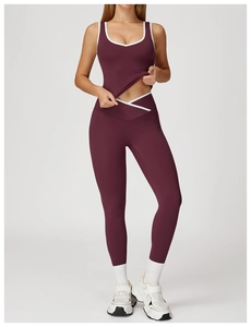 Close-up of contrast trim on V-cross high waist yoga leggings and sports crop top