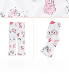 Detail of girls' flared leggings featuring cute rabbit and floral prints on ribbed fabric