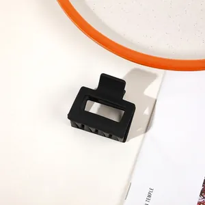 Detail view of square hollow matte black hair claw clip for thick hair styling