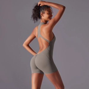 Detailed back view of dark gray yoga romper with open back and ruched peach butt lift effect