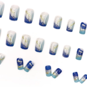 Blue and white gradient press-on nails with gold foil lines and glitter, 24 piece set