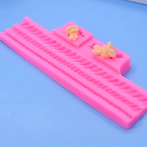 Pink silicone rope twist mold for cake decorating and fondant with braided cord patterns