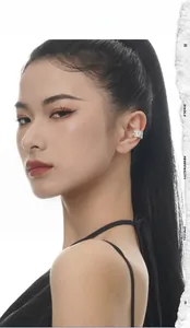 Close-up of S925 sterling silver ear cuff with intricate hollow mesh weaving texture