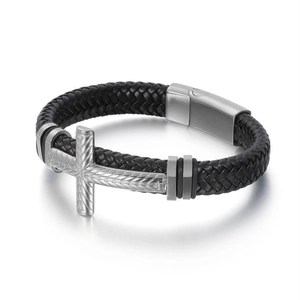 Close-up of black braided leather bracelet featuring a textured silver cross and magnetic clasp