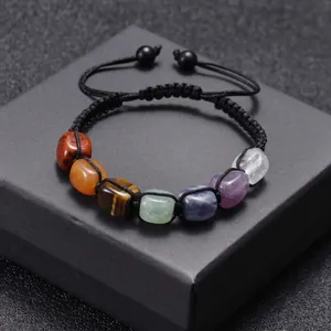 Adjustable woven bracelet with seven natural chakra stones and black tiger eye beads