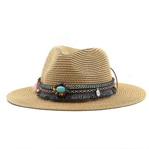 Straw sun hat with bohemian beaded band and turquoise stone in natural summer style