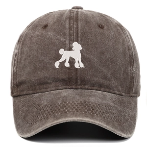 Close-up of vintage washed cotton baseball cap featuring detailed white poodle embroidery
