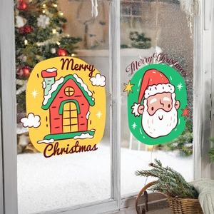 Christmas window stickers showing Santa and snow house decals on glass with snowy background