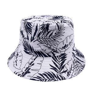 Close-up of high-density cotton canvas bucket hat with dark palm leaf print