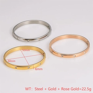 Polished stainless steel crystal bangle set in silver, gold, and rose gold finishes