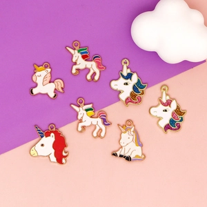 Golden unicorn charms set with colorful enamel and glitter for DIY jewelry making