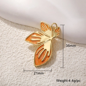 Detail view of orange leaf pendant showing dimensions 35mm height and weight 4.4g