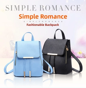 Detailed view of sky blue and black PU leather backpacks with gold metal bar details