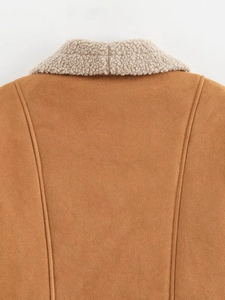 Detail of brown faux suede texture and off-white shearling collar on the vintage jacket