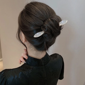 Elegant vintage silver hair pin with white rhinestones for buns on deep brunette hair