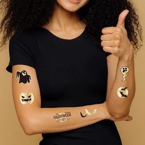 Tatouages éphémères d'Halloween avec fantômes dorés, citrouilles et chauves-souris
