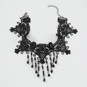 Detailed view of black lace choker with hanging faceted bead tassels and adjustable chain