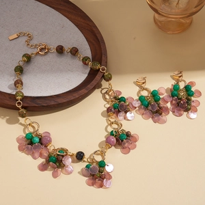 Bohemian jewelry set with stone beads and purple shell discs on a gold chain