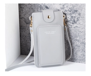 Close-up of grey PU leather crossbody bag featuring card slots and golden hardware