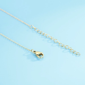 Close-up of the lobster clasp and adjustable extension chain on the gold heart necklace