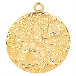 Macro shot of gold stainless steel Tree of Life pendant featuring sun and moon relief