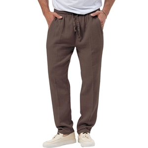 Detail of coffee brown men's leisure pants featuring drawstring waist and pleated texture