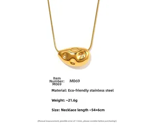 Detailed view of irregular molten lava pendant on an 18K gold plated stainless steel snake chain