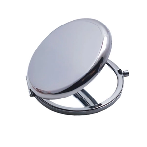 Portable silver round metal makeup mirror with a polished finish and folding design