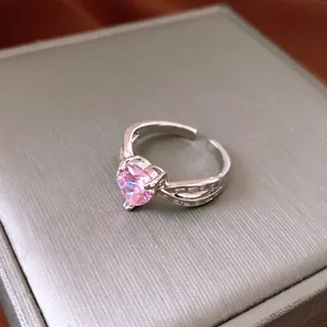 Elegant adjustable ring with heart-shaped pink zircon and silver finish on jewelry box