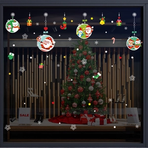 Christmas window static stickers featuring Santa, snowman, and reindeer on glass display