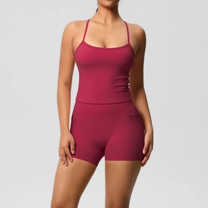 Close-up of burgundy high-waist yoga shorts with functional side pockets and smooth fabric