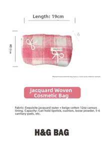 Detail view of pink checkered makeup bag with 3D bows and durable jacquard fabric texture