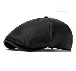 Close-up of black leather newsboy cap showing detailed texture and retro stitching