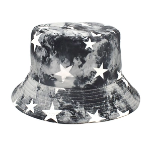 Detail of star pattern tie-dye bucket hat with reinforced stitching and cotton canvas texture