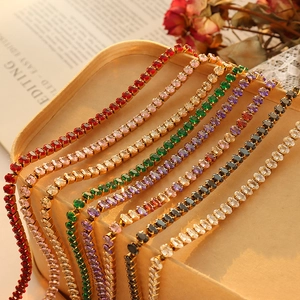 Elegant gold necklaces set with colorful zircon crystals in red green and purple stones