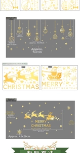 Detail of golden Christmas window stickers with Santa sleigh and snowflakes for holiday decor