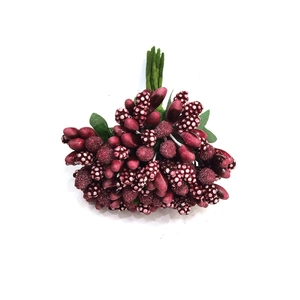 Close-up of deep red artificial berry stems with mixed textures for DIY crafts